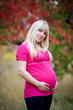Photo: Young beautiful pregnant woman with long hair. Young beautiful pregnant woman with long hair.