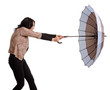 Woman battling with her umbrella in wind