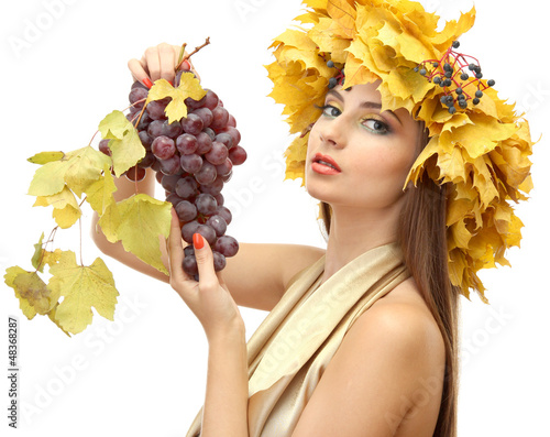 Photo: beautiful young woman with yellow autumn wreath and grapes, beautiful young woman with yellow autumn wreath and grapes,