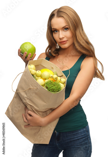 Photo: woman with shopping bag full of fruits woman with shopping bag full of fruits