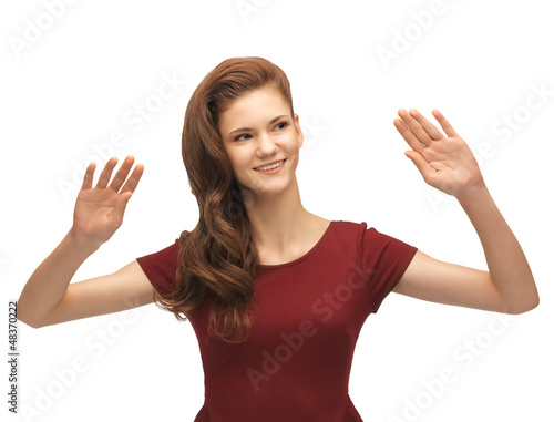 Photo: girl in red dress working with something imaginary girl in red dress working with something imaginary