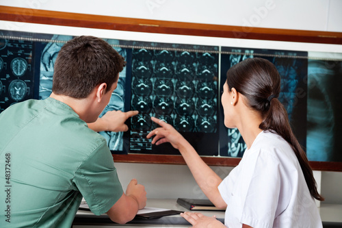 Photo: Medical Technicians Pointing At MRI X-ray Medical Technicians Pointing At MRI X-ray