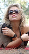 Blond young woman posing outdoor