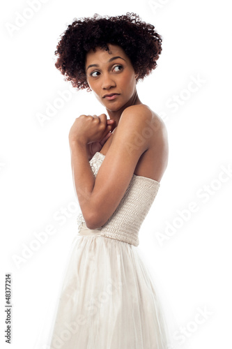 Photo: Amazed lady looking backwards intently Amazed lady looking backwards intently