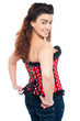 Flirtatious trendy female model in corset top and jeans