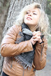 Blonde young woman at the woods