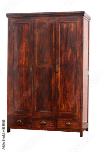 Photo: Old hancrafted cupboard isolated over white background Old hancrafted cupboard isolated over white background