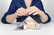 Photo: Protect house - insurance concept Protect house - insurance concept
