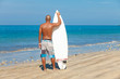 young man with surfboard