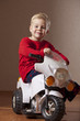 Happy Boy on Toy Motorcycle