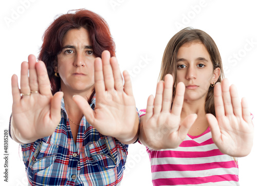 Photo: Latin women signaling to stop with their hands Latin women signaling to stop with their hands