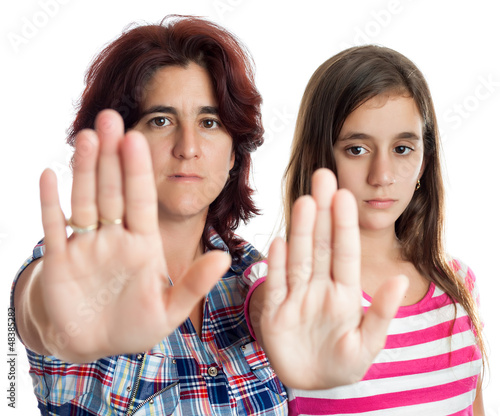 Photo: Latin women signaling to stop with their hands Latin women signaling to stop with their hands