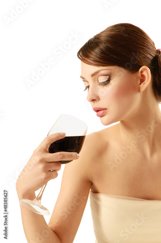 Photo: Beautiful brunet girl drinking red wine Beautiful brunet girl drinking red wine