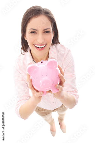 Photo: Woman holding piggy bank Woman holding piggy bank