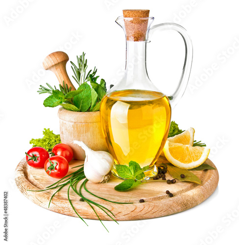 Photo: spice and spice with olive oil isolated on white background spice and spice with olive oil isolated on white background