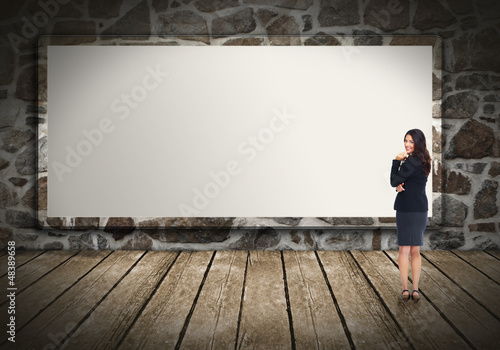 Photo: Business woman near billboard. Business woman near billboard.