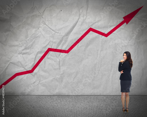 Photo: Business woman looking chart. Business woman looking chart.