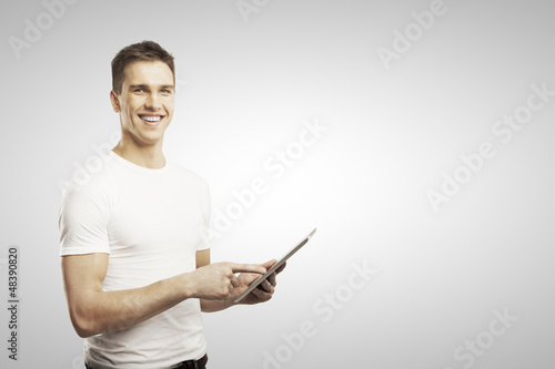 Photo: man holding tablet man holding tablet