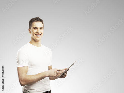 Photo: man holding touch pad man holding touch pad