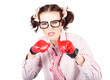 Determined young woman in boxing gloves