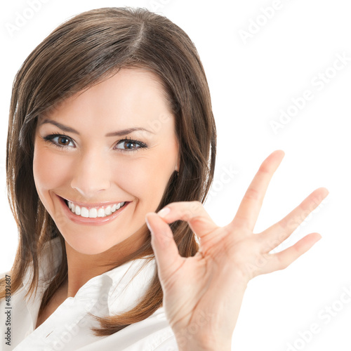 Photo: Businesswoman with okay gesture, isolated Businesswoman with okay gesture, isolated