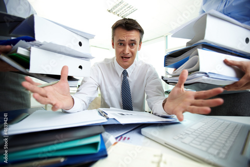 Photo: Overloaded with paperwork Overloaded with paperwork