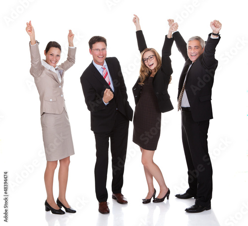 Photo: Four businesspeople celebrating Four businesspeople celebrating