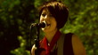 Two young singers performing alive outdoors. Old movie.