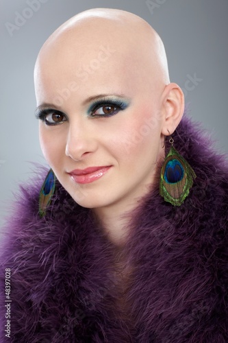 Photo: Portrait of hairless woman in purple boa Portrait of hairless woman in purple boa