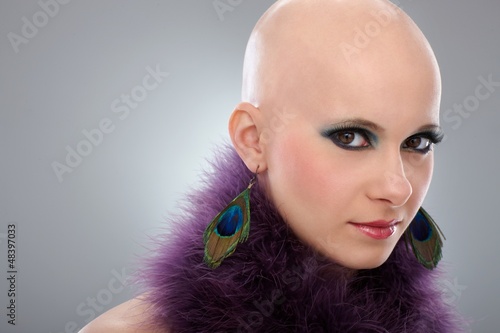 Photo: Portrait of bald woman in purple boa Portrait of bald woman in purple boa