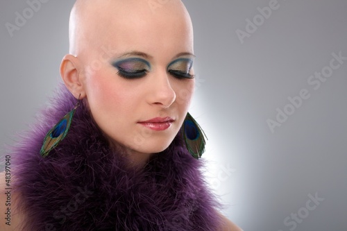 Photo: Portrait of hairless woman in purple boa Portrait of hairless woman in purple boa