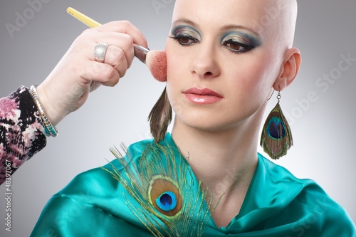 Photo: Bald woman getting makeup Bald woman getting makeup
