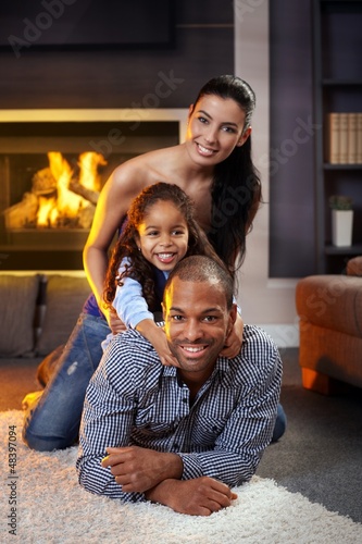 Photo: Portrait of happy family of three Portrait of happy family of three