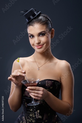 Photo: Smiling party woman with cocktail Smiling party woman with cocktail