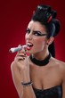 Wicked woman smoking banknotes