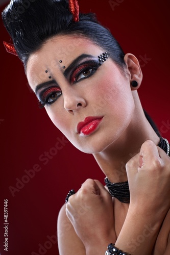 Photo: Devil woman with clenched fists Devil woman with clenched fists