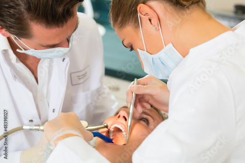 Photo: Patient with Dentist - dental treatment Patient with Dentist - dental treatment