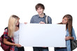 Three teenagers holding message board