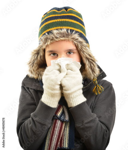 Photo: Little child having flu or allergy isolated over white Little child having flu or allergy isolated over white