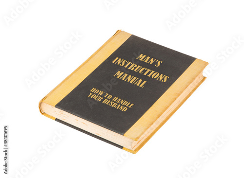 Photo: Old book with a mans instructional manual concept title Old book with a mans instructional manual concept title
