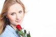 Beautiful young woman with red rose
