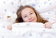 Young cute girl resting on the bed