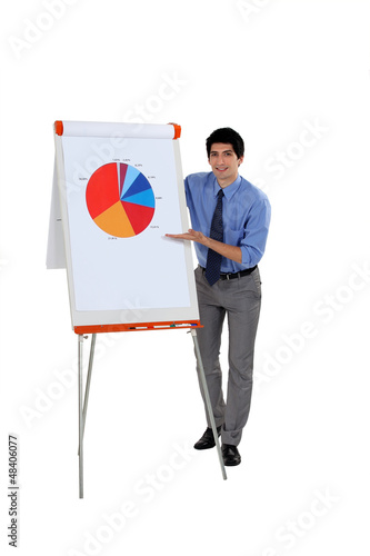Photo: Businessman presenting a pie chart Businessman presenting a pie chart