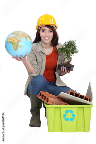 Photo: craftswoman posing with recycling tub craftswoman posing with recycling tub