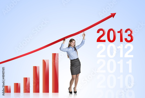 Photo: Woman with statistics curve Woman with statistics curve
