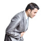 Business man with stomach ache with hands on abdomen