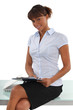 Attractive secretary holding a clipboard