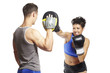 Photo: Young man and woman boxing sparring Young man and woman boxing sparring