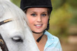 Blond female horse rider