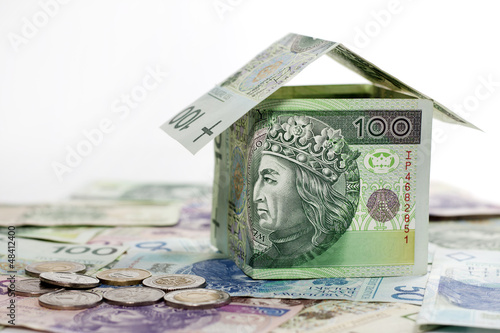 Photo: House made of polish money credit and construction concept House made of polish money credit and construction concept